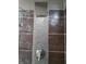 Close-up of shower featuring hexagon tile and stainless steel shower head at 2479 Peachtree Ne Rd # 1115, Atlanta, GA 30305