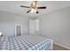 Bedroom with a gray and white plaid comforter and a mirror at 5345 Coltman Dr, Cumming, GA 30028