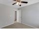 Bedroom with ceiling fan and door way to the closet at 5345 Coltman Dr, Cumming, GA 30028