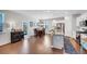 Dining area flowing into kitchen features hardwood floors, stainless steel and a glass door at 5345 Coltman Dr, Cumming, GA 30028