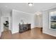 This living room has natural light, hardwood floors and a large decorative cabinet at 5345 Coltman Dr, Cumming, GA 30028