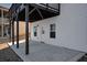 Concrete patio under a second-story deck with white siding and a view to the backyard at 5345 Coltman Dr, Cumming, GA 30028