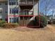 A ground-level back porch with a wooden fence offers outdoor space for relaxing or entertaining at 601 Park Ridge Cir, Marietta, GA 30068