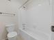 Bathroom with tile flooring, white tub, shower, and toilet at 601 Park Ridge Cir, Marietta, GA 30068