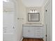 Bright bathroom features a vanity with a granite countertop, updated hardware and a soaking tub with shower at 601 Park Ridge Cir, Marietta, GA 30068