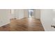 Spacious bedroom with hardwood floors and access to the bathroom and sliding glass door at 601 Park Ridge Cir, Marietta, GA 30068