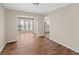 Dining area leading to sunroom and kitchen, featuring hardwood floors at 601 Park Ridge Cir, Marietta, GA 30068