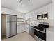 Stylish kitchen featuring stainless steel appliances and bright white cabinetry at 601 Park Ridge Cir, Marietta, GA 30068