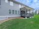 Backyard view of a home with gray siding and a covered deck perfect for outdoor entertaining and relaxation at 274 Fountain Oak Way, Canton, GA 30114