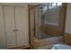 Bathroom showcasing a glass-enclosed shower and a luxurious soaking tub at 3534 S Sherwood Se Rd, Smyrna, GA 30082