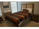 Comfortable bedroom featuring a stylish upholstered headboard, neutral decor, soft bedding, and bedside tables for convenient storage at 3534 S Sherwood Se Rd, Smyrna, GA 30082