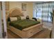 Serene bedroom showcasing a tufted headboard bed, soft lighting, and neutral decor at 3534 S Sherwood Se Rd, Smyrna, GA 30082