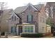 Beautiful two-story home with gray brick, trimmed windows and manicured landscaping at 3534 S Sherwood Se Rd, Smyrna, GA 30082