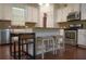 Well-equipped kitchen with white cabinets, stainless steel appliances, and granite countertops at 3534 S Sherwood Se Rd, Smyrna, GA 30082