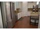 Modern kitchen with stainless steel appliances, granite countertops, and a large island with bar seating at 3534 S Sherwood Se Rd, Smyrna, GA 30082