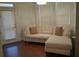 Inviting living room featuring a comfortable sectional sofa and large bright windows at 3534 S Sherwood Se Rd, Smyrna, GA 30082