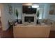 Cozy living room with fireplace, neutral furniture, and elegant decor at 3534 S Sherwood Se Rd, Smyrna, GA 30082