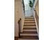 Staircase features wooden stairs, white risers, and iron railing at 3534 S Sherwood Se Rd, Smyrna, GA 30082