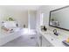 Elegant bathroom with a soaking tub and modern vanity at 157 Pebble Path, Douglasville, GA 30134