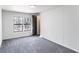 Bright bedroom with large windows and plush gray carpet at 157 Pebble Path, Douglasville, GA 30134
