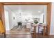 Bright kitchen featuring a breakfast bar and modern lighting at 157 Pebble Path, Douglasville, GA 30134