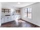 Modern room featuring sleek cabinetry, wood floors, and bright windows at 157 Pebble Path, Douglasville, GA 30134