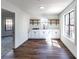 Bright room with modern cabinetry, wood floors and natural light from windows at 157 Pebble Path, Douglasville, GA 30134