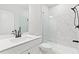 Modern bathroom with a sleek vanity, glass-enclosed shower, and stylish black fixtures at 7685 Homer Dr, Cumming, GA 30028