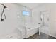 Elegant bathroom boasting a glass shower, soaking tub, and sleek tile work for a spa-like experience at 7685 Homer Dr, Cumming, GA 30028