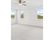 Bright and airy bedroom with three large windows providing lots of natural light at 7685 Homer Dr, Cumming, GA 30028