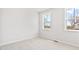 Bright bedroom with two large windows offering outside views and letting in natural light at 7685 Homer Dr, Cumming, GA 30028