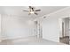 Bedroom with a ceiling fan and two closets at 7685 Homer Dr, Cumming, GA 30028
