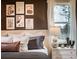 Comfortable bedroom with natural light showcases a stylish bedside table and tasteful wall art at 7685 Homer Dr, Cumming, GA 30028