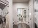 Stylish entryway with decorative wall hanging and French doors leading to a brightly lit home office at 7685 Homer Dr, Cumming, GA 30028