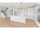 Large kitchen island, stainless steel appliances, and open layout, perfect for modern living at 7685 Homer Dr, Cumming, GA 30028