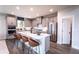 Kitchen featuring stainless steel appliances and a large island with seating at 7685 Homer Dr, Cumming, GA 30028