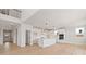 Open-concept kitchen featuring a center island, stainless steel appliances, and hardwood floors at 7685 Homer Dr, Cumming, GA 30028