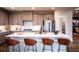 Modern kitchen featuring stainless steel appliances and a large island with seating at 7685 Homer Dr, Cumming, GA 30028