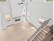 Aerial view showcasing open-concept living room with fireplace and an abundance of natural light at 7685 Homer Dr, Cumming, GA 30028
