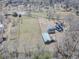 An aerial view of the home, outbuildings, gardens and the surrounding property at 3179 Meadow Trl, Loganville, GA 30052