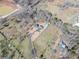 An aerial view of the home, outbuildings, gardens and the surrounding property at 3179 Meadow Trl, Loganville, GA 30052