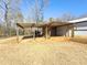 A tractor parked under an open metal barn at 3179 Meadow Trl, Loganville, GA 30052