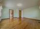 Bright bedroom with hardwood flooring, multiple doors and a closet at 3179 Meadow Trl, Loganville, GA 30052