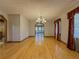 Spacious dining room featuring hardwood floors and a stylish chandelier at 3179 Meadow Trl, Loganville, GA 30052