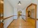 Welcoming foyer with gleaming hardwood floors and arched doorways at 3179 Meadow Trl, Loganville, GA 30052