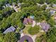 A wide aerial view captures the home's location within a lush neighborhood setting at 475 Highland Gate Cir, Suwanee, GA 30024