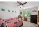 Inviting bedroom with patriotic decor, a ceiling fan, and a dresser at 475 Highland Gate Cir, Suwanee, GA 30024