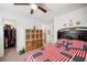 Comfortable bedroom with a patriotic quilt, a ceiling fan, and a walk-in closet at 475 Highland Gate Cir, Suwanee, GA 30024