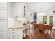 Sunlit breakfast nook and kitchen area featuring white cabinets and stainless steel appliances at 475 Highland Gate Cir, Suwanee, GA 30024