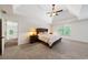 Relaxing main bedroom with tray ceilings, natural light, and neutral carpeting at 475 Highland Gate Cir, Suwanee, GA 30024